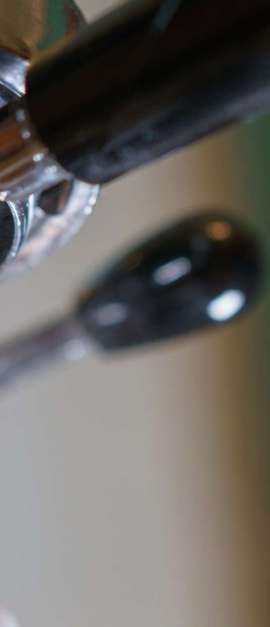 espresso pouring from bottomless portafilter, low angle shot